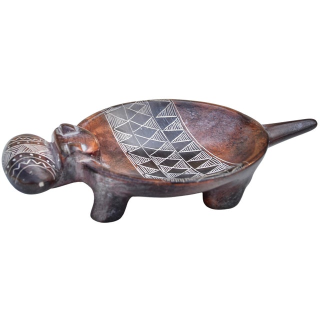 Impressive one-of-a-kind vintage West-African rhino figurine footed bowl handmade from natural heavy soapstone. Showcasing...