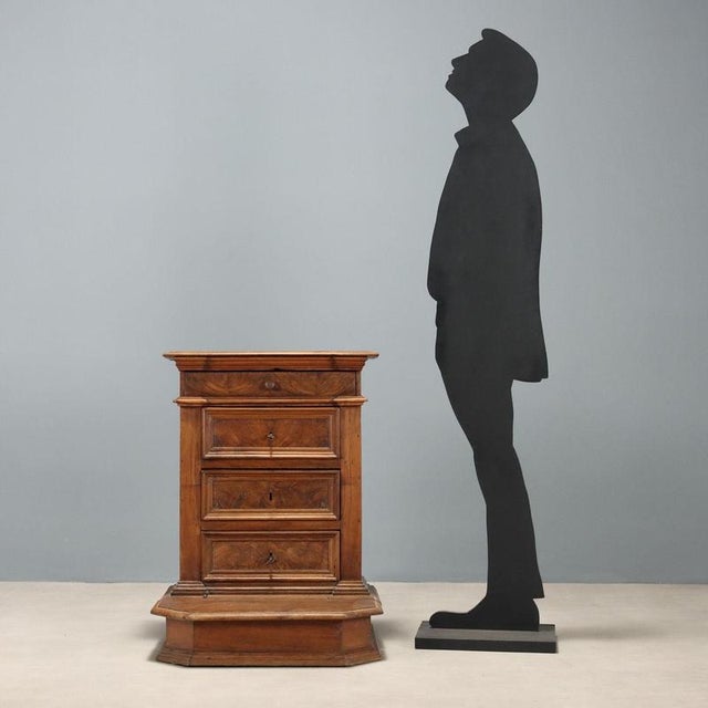 Baroque walnut kneeler. Drawer in the lower section and three additional drawers underneath. The kneeler's top folds down,...