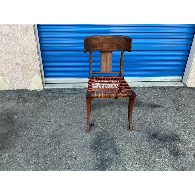Klismos modern walnut chair. Chair is made of solid walnut and have a natural walnut finish. Chair is in beautiful...