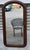 Beautiful 19th Century American Victorian walnut wall mirror featuring a classic arched-top frame with a rich natural...