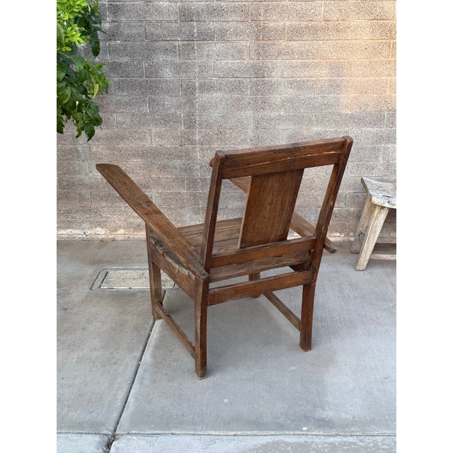 Add classic charm to your home with this beautiful plantation chair. Featuring a sturdy wood frame and a comfortable,...