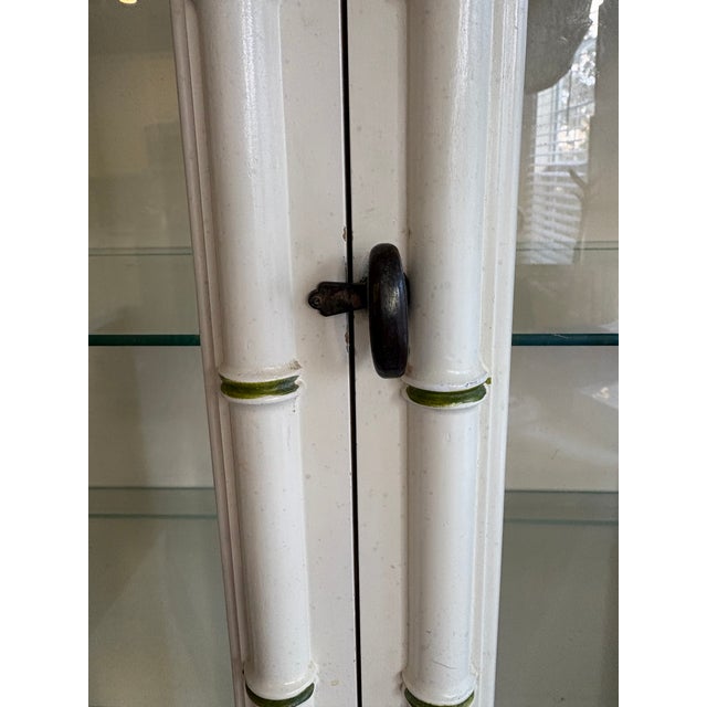 Drexel China cabinet is made with solid wood and faux Bamboo. IT has the original Hardware as seen in photos. This...