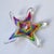 A vibrant signed handblown art glass starfish by acclaimed glass artist Luke Adams. This piece showcases layered, swirling...