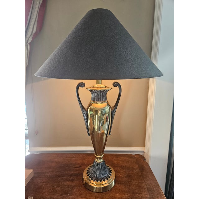 The Frederick Cooper Brass Trophy Urn Table Lamp exudes style with its large size and sleek design. Standing at 32" tall...