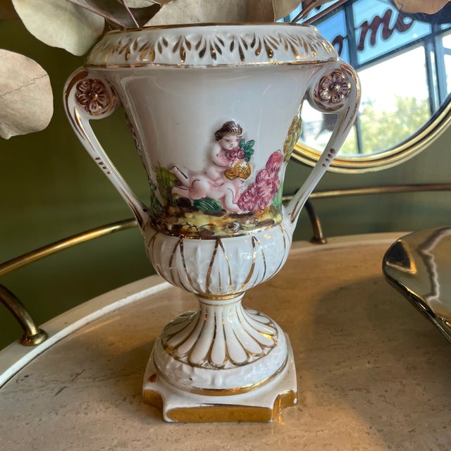 Beautiful + rare double handled baroque vase by Capodimonte. In porcelain with gorgeous hand-painted details + gold...