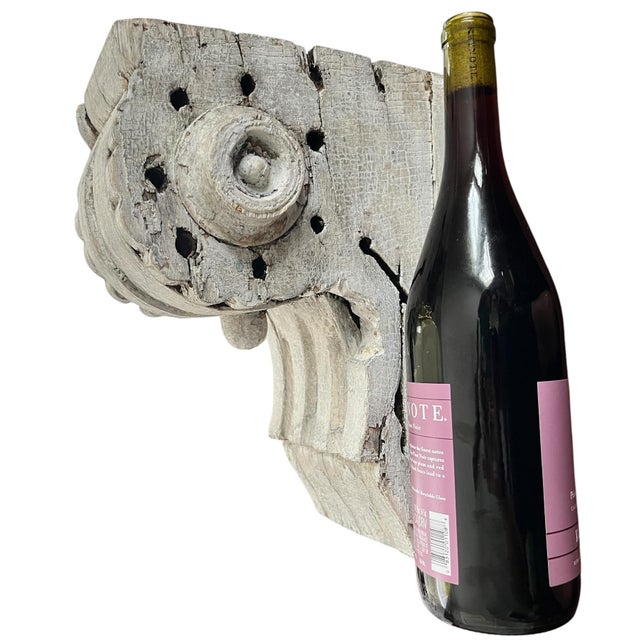 A striking antique architectural corbel or bracket fragment with extraordinary age, texture, and sculptural presence....