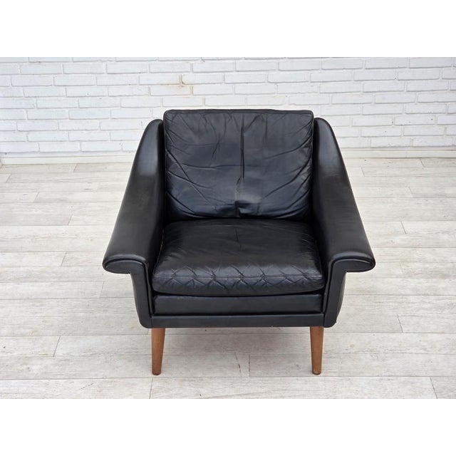 1960s, Danish armchair by Aage Christensen. Original black furniture leather, teak wood legs. Original good condition: no...