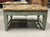 A wonderful pair of distressed leather top painted benches we purchased from a diverse Palm Springs estate. The estate...