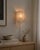 Thick pressed glass with a deep vertical striated texture — when lit, the surface catches and scatters light in shifting,...