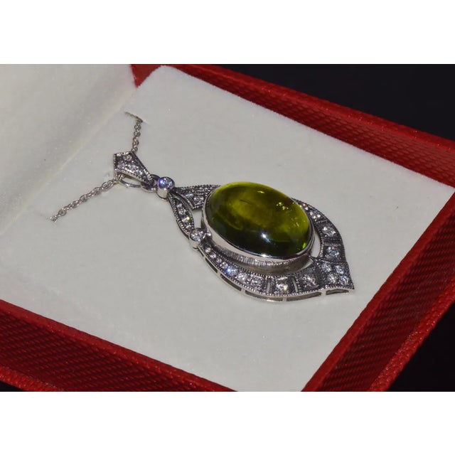 Gorgeous 18K solid gold certified 28.17CTS natural green tourmaline and diamond pendant. This pendant has a stunning Art...