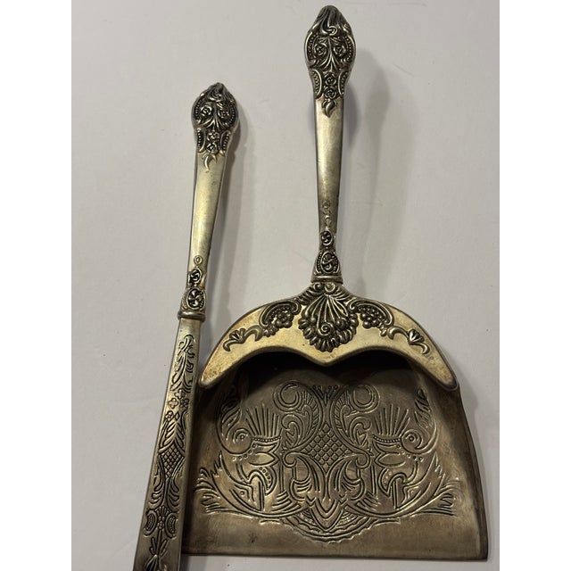 This is a vintage Godinger Silver ART Co. (GSA) silver-plated silent butler, or crumb catcher set.