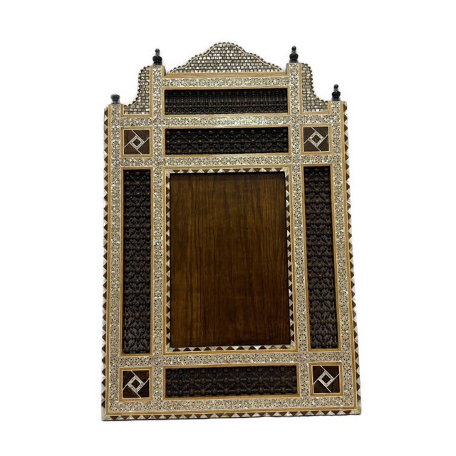 Handcrafted in Egypt with genuine inlaid mother of pearl, this mirror frame captures the timeless artistry of traditional...