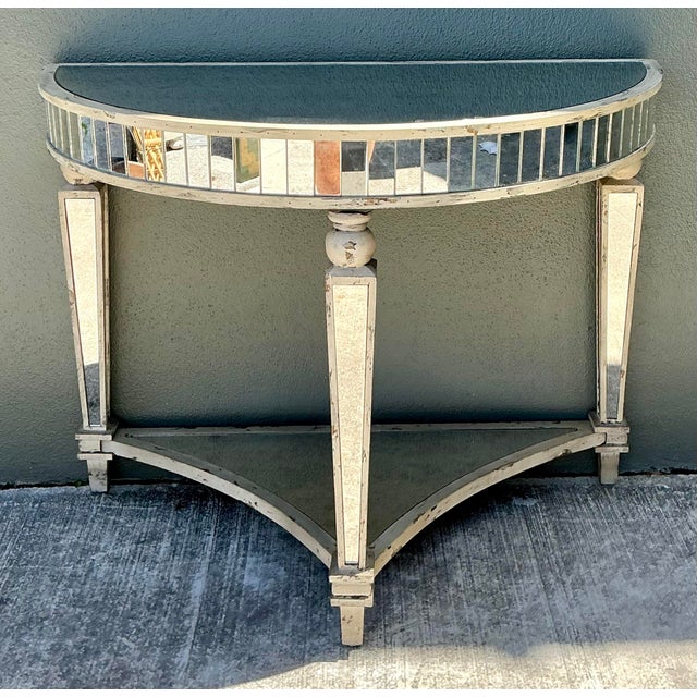 Elevate your entryway with this stunning vintage Hollywood Regency demilune console table. A masterclass in late-century...