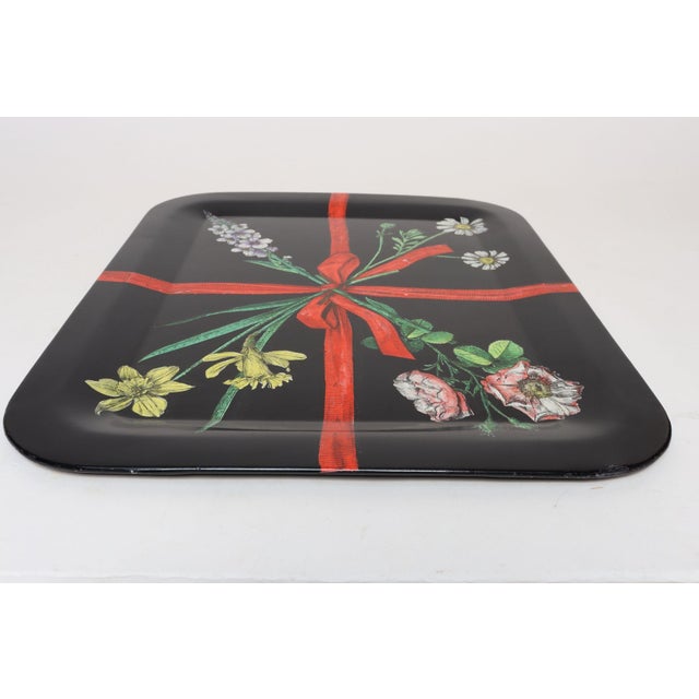 Italian Modernist trompe-l'œil tray by Piero Fornasetti (ca. mid-1950 - early 1960s, Milan). Composed of a black lacquered...