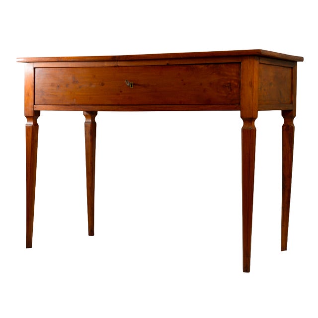 This elegant antique Italian console table was handcrafted in solid cherrywood during the late 18th or early 19th century...