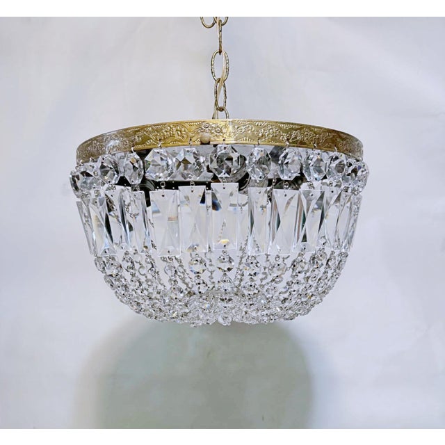 Bring the timeless grandeur of an upscale Parisian apartment into your home with this magnificent vintage crystal basket...