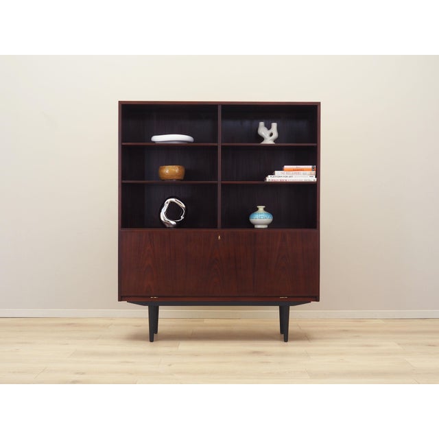 The bookcase was made in the 1970s, produced by the well-known Danish manufactory Omann Jun. Model no. 9. The structure is...