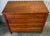 Gorgeous antique Sheraton style 4-drawer chest, crafted from cherry wood early 19th century. Features hand-cut dovetail...