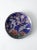 A vintage cloisonné enamel plate in deep cobalt blue with gold trim and intricate detailing. features a finely rendered...