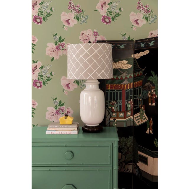 A sample of Swans Island Meadow Green Wallpaper Care Instructions: Wipe with damp cloth.