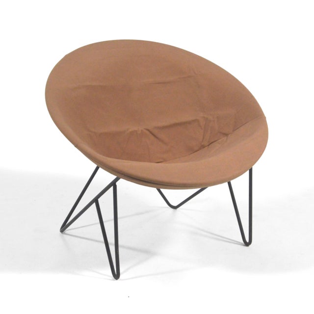 A striking mid-century design in wrought iron with a canvas sling seat, this easy chair by Hedstrom has a dynamic quality...