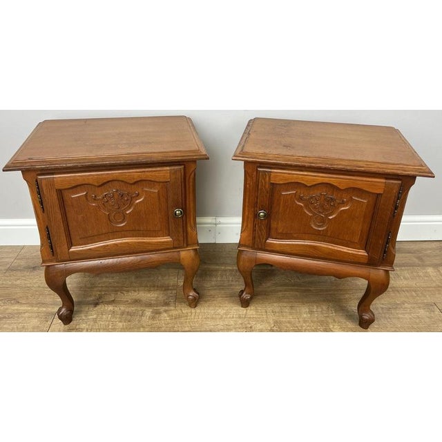 Bring timeless French charm to your home with this elegant pair of Vintage French Louis bedside tables. Crafted from oak,...