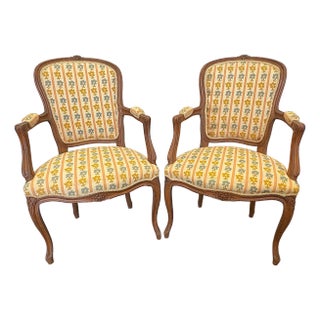 Vintage French Louis XV Style Cabriole Arm Chairs With Carved Wood Flower Details- A Pair For Sale
