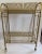 This is new in the box never used record rack. Gold tone Mid Century Modern album holder.