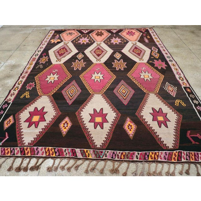 A vintage Turkish tribal flatweave Kilim room size carpet handmade during the mid-20th century. Measures: 10' 7" x 14' 0"