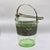 Elevate your bar cart with this striking 1930s Art Deco green depression glass ice bucket. Featuring a radiant optic swirl...