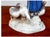 A charming vintage Bing & Grøndahl porcelain figural sculpture, “Girl With Geese,” designed by Danish sculptor Axel...