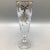 Get ready to celebrate the holidays with these Libbey Celebration white floral and gold ribbon champagne flutes.