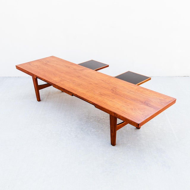 Vintage Scandinavian mid century modern cocktail table with stowable drink trays, made in Denmark c. 1960s. A case study...