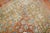 An early 20th-century oversize decorative Chinese rug with an all-over design on a faded peach field accents in brown,...