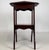 A charming early 20th-century English Edwardian side table, finely crafted from mahogany and distinguished by its elegant...