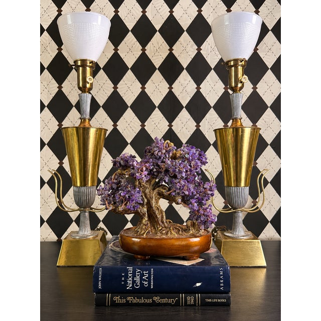 Striking pair of Tommi Parzinger table lamps with tall architectural proportions and a sophisticated mixed-metal...
