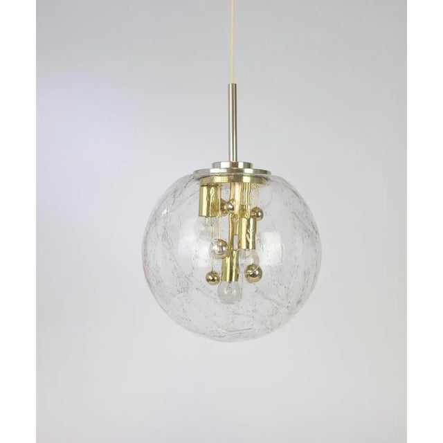 Doria ceiling light with large volcanic murano crystal glass dome on golden aluminum base. Between the four bulbs are...