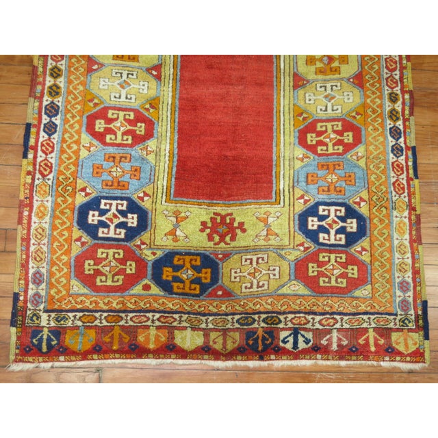 An early 20th century Turkish Prayer rug with a colorful prayer motif. 3'7'' x 5'1''