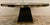 Original retail $10,079, stylish Century Modern Black Cerused Oak Corso 72” Round Dining Table, champagne silver trim,...
