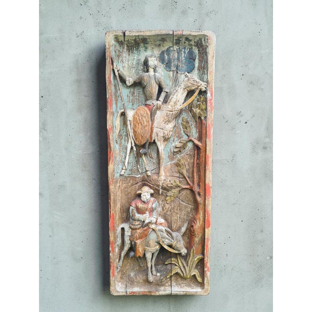 A unique, hand-carved relief depicting one of the world’s most recognizable literary scenes—don quixote and sancho panza....