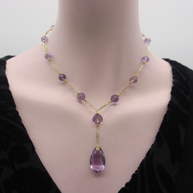 This is part of Chairish’s Fine Jewelry assortment. The hand faceted Rose de France amethyst beads in this 14k gold...