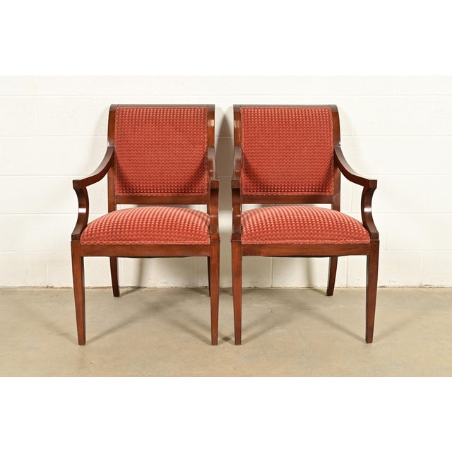 A gorgeous pair of Regency style armchairs or dining captain chairs By Smith & Watson USA, Circa Late 20th Century Carved...