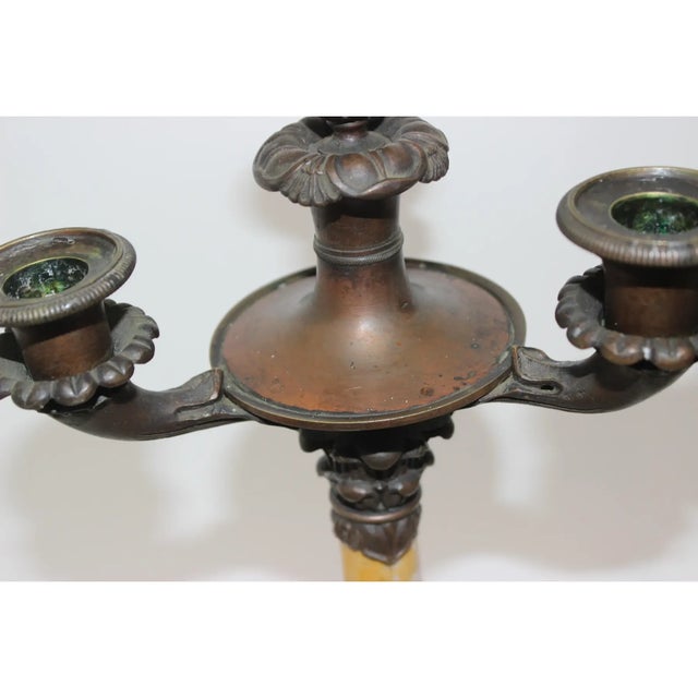 Bronze & Marble. This stylish and chic pair of Charles X early 19th century candlesticks will make a statement with their...