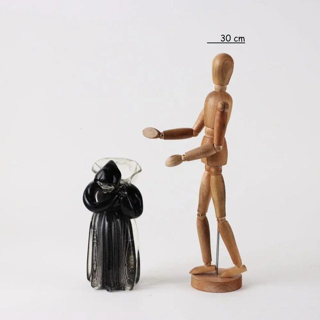 Glass sculpture depicting Woman with Archimedes Seguso gerla. Under the base signature of the manufacture. This piece is...