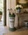 A charming late 19th century painted wicker umbrella basket with a beautifully weathered green and white surface. The tall...