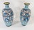 We are selling this pretty pair of Japanese cloisonne vases. These vases are decorated in a blue palette with dragon and...