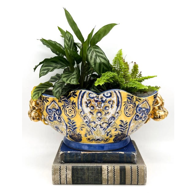A striking vintage Italian majolica centerpiece bowl showcasing intricate hand-painted scrollwork and florals in cobalt...