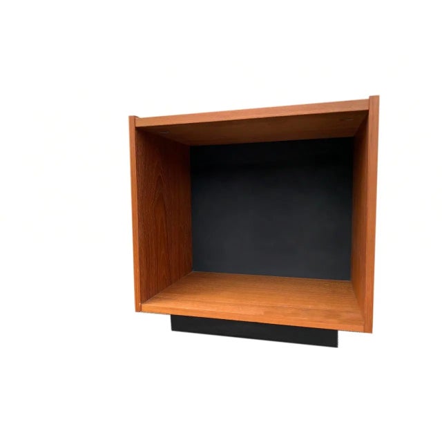 Mid Century Danish Teak side tables by Bornholm. Black leather insets on top and front. Doors cover a spacious storage...