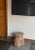A striking sculptural side table crafted from solid teak wood, distinguished by its dramatic organic form and deeply...