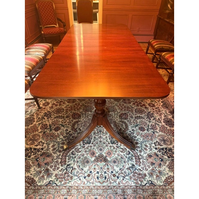 Authentic early 1900 Drexel Durham Duncan Phyfe dining set in solid mahogany. Includes pedestal table, three leaves,...